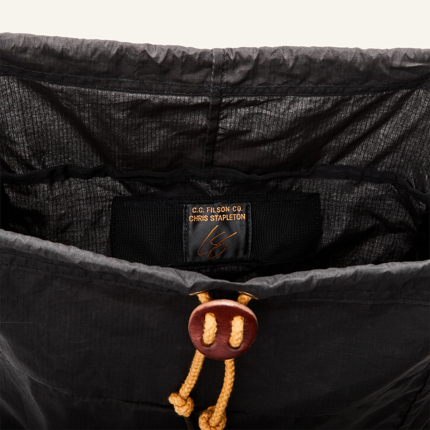 FILSON TRAVELLER STOWAWAY BACKPACK - CINDER